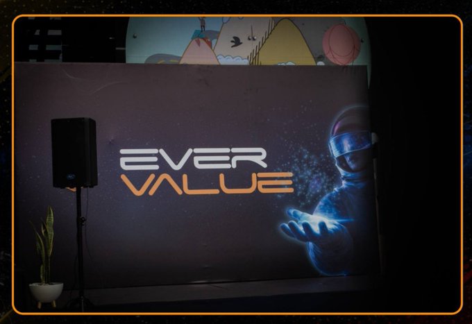 The "EverValue" branding appears on a screen displaying an astronaut holding glowing particles, fitting the post's warning against crypto hype and empty promises of quick riches. The space imagery subtly reinforces the "moonshot" mentality common in crypto marketing that the post critiques.