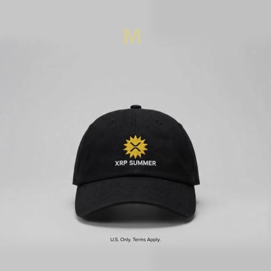 A black baseball hat featuring a gold XRP sun logo and the text "XRP SUMMER" is displayed against a light gray background with the note "U.S. Only. Terms Apply." at the bottom, promoting the limited-edition "XRP Summer" hat giveaway mentioned in the post.