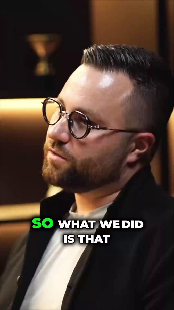 The image shows a man wearing glasses, sitting with his head tilted back as he looks off into the distance. The caption below the photo reads "So What We Did Is That", which seems unrelated to the main subject of the image. It is unclear what this caption means or how it relates to the man and his surroundings.