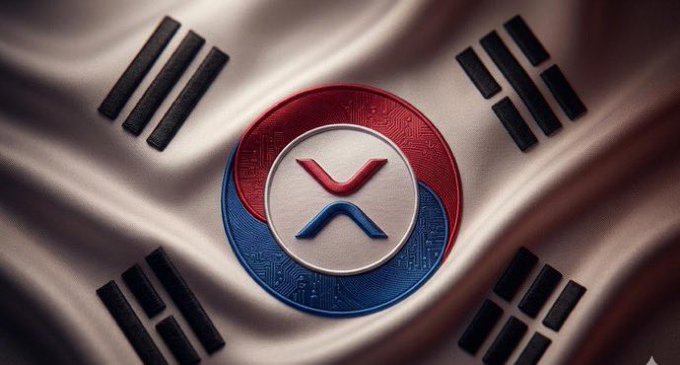 A close-up of a stylized XRP (Ripple) cryptocurrency coin with its red and blue logo, resting on a South Korean flag (Taegukgi).