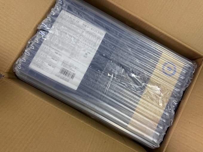 An inflatable air column packaging cushion inside a cardboard shipping box protecting a package with a shipping label.