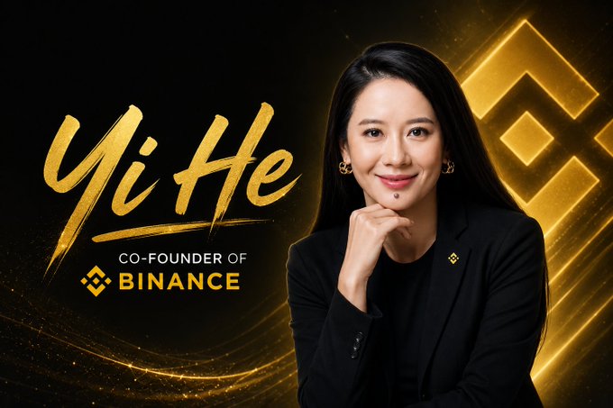 The image features a woman with long black hair, dressed in a black blazer, posing for a portrait. She has her hand placed on her chin and is smiling at the camera. The background of the image is black, which contrasts with the gold text that reads "yi He Co-Founder of Binance". This text is positioned above the woman's head, making it the focal point of the image.