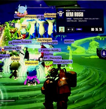 Screenshot from the video game 'Gem Rush' showing multiple player avatars with usernames like JayVegas, mx, NIKOVI, and Dinopawg on a green alien landscape with a timer at 00:36.55.