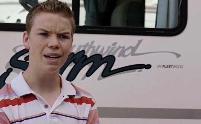 A young man stands in front of an RV with "Southwind by Fleetwood" branding, speaking as if addressing viewers directly—possibly explaining how to trade or invest through Robinhood in response to the post's question about getting started with the platform.