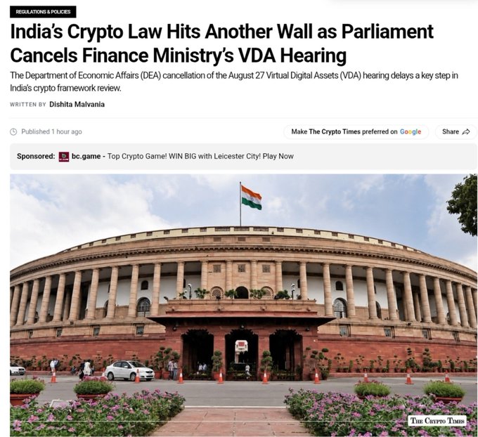 A news article screenshot from The Crypto Times titled 'India's Crypto Law Hits Another Wall as Parliament Cancels Finance Ministry's VDA Hearing' by Dishita Malvania, showing the Indian Parliament building with its tricolor flag.