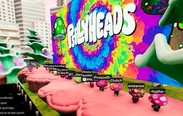 The image features a colorful mural of mushrooms, with the words "Palyheads" written above them. The mural is located behind a row of small mushroom figurines or statues that are lined up against a wall. There are also several other smaller mushroom figurines scattered throughout the scene. In addition to these mushroom-themed elements, there are some text elements in the image such as "hypha3d", "@OthersideMeta @OtherGamesXYZ @GiantYuppie @PsillyHeads @honeybd @MimaDlaCruz @Timmygspt @mimuonape".