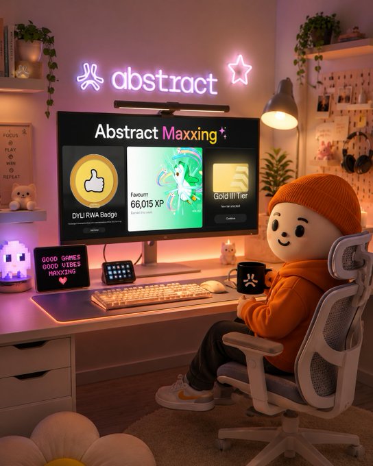 Cozy gaming room setup featuring a monitor displaying 'abstract' and 'Abstract Maxxing' content with 'DYL RWA Badge' and '66,015 XP' visible, accompanied by neon signs and a plush figure at the desk.