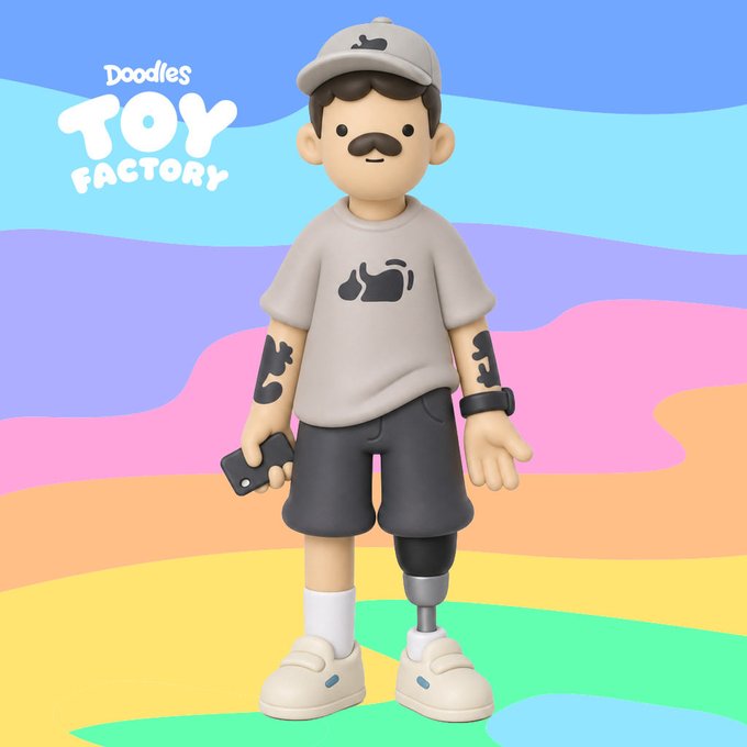 A 3D-rendered cartoon figure of a man with a mustache, wearing a cap and t-shirt with animal graphics, has a prosthetic leg and stands against a colorful pastel background with 'Doodles TOY FACTORY' text.