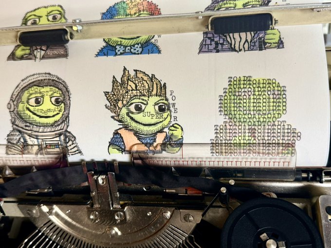 A typewriter prints characters resembling Pepe the Frog, including an astronaut, a 'POWER' character, and ASCII art.