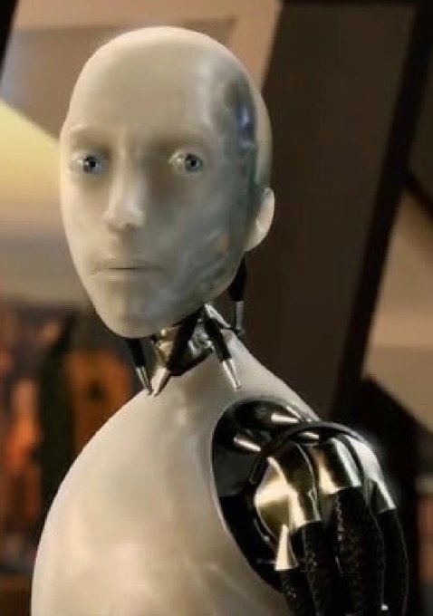 A close-up of a humanoid robot with a glossy white face, blue eyes, and metallic joints.