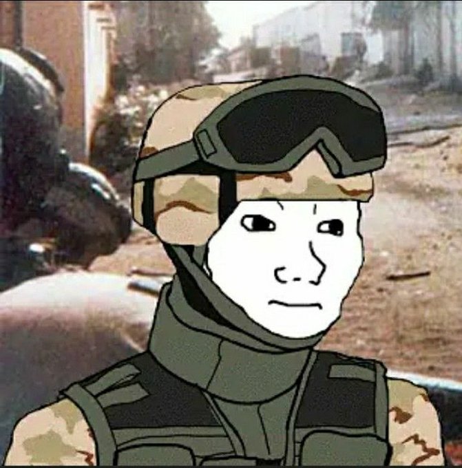 A wojak-style meme character wearing military camouflage gear and goggles against a war-torn background.