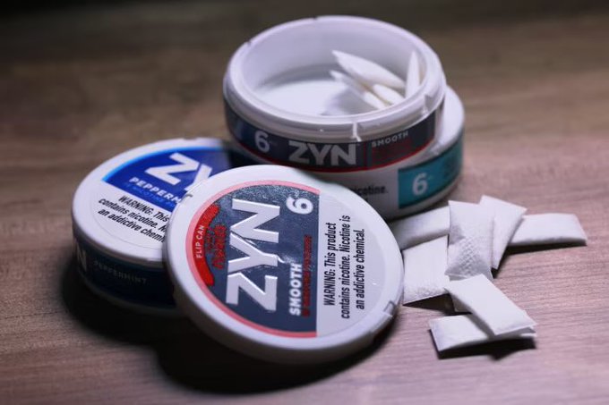 Three ZYN nicotine pouches are displayed, including Smooth (6mg) and Peppermint (6mg) varieties, with the warning "This product contains nicotine. Nicotine is an addictive chemical" visible on the labels. The image ties into the "bullrun" reference through ZYN's parent company Philip Morris International (ticker: PM), a popular stock often associated with bullish market sentiment.