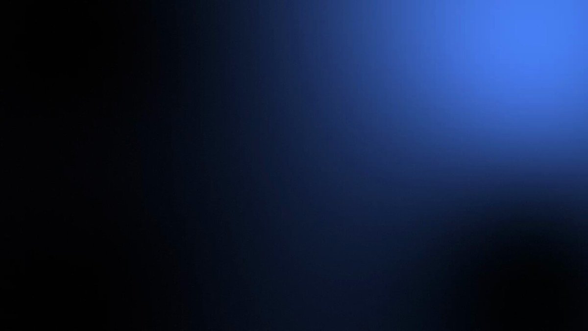 The image shows a large square with a gradient background transitioning from black at the top to blue at the bottom, creating an interesting visual effect. There are no texts or other objects present in the image.