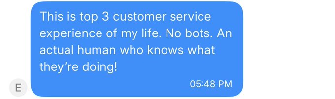 A blue text message screenshot from 'E' at 05:48 PM reading: 'This is top 3 customer service experience of my life. No bots. An actual human who knows what they're doing!'