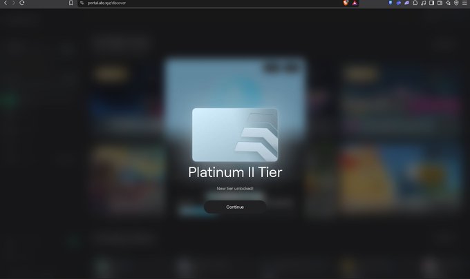 A screenshot from portaia.ai.xyz/discover showing a 'Platinum II Tier' notification with 'New tier unlocked!' and a 'Continue' button against a blurred background.