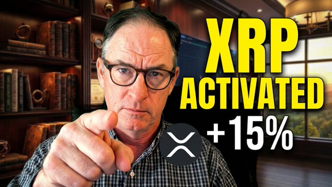 A serious-looking man with glasses points at the camera in front of a bookshelf, with bold yellow text reading "XRP ACTIVATED +15%" alongside the XRP logo, promoting a video about Ripple's recent price surge and the CEO's White House visit.