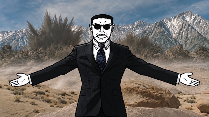A stylized cartoon figure of a stern-looking man in a dark suit, tie, and sunglasses stands with arms outstretched in a rocky desert landscape, with plumes of dark smoke rising from explosions behind snow-capped mountains. The dramatic, action-packed backdrop visually reinforces the post's message about how what you "hold" (whether literal tools or metaphorical leverage/strength) determines your power and visibility more than personal identity or status.