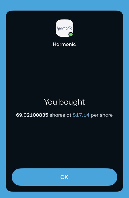 The image shows a cellphone with a screen shot of the Harmony app, which is an audio editing app. On the bottom left corner of the screen shot, there is text that reads "You bought $69,09835 shares at $17,14 per share". This indicates that the user has purchased shares in the Harmony app for a total cost of $67,09835 and received $17,14 per share.