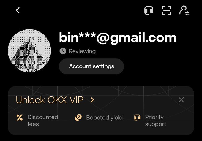 A screenshot of an OKX account profile page showing a partially censored Gmail email address, a "Reviewing" status, and an OKX VIP upgrade banner advertising discounted fees, boosted yield, and priority support. The image accompanies a post promoting OKX account creation from Bangladesh using a referral code, with the "Reviewing" status suggesting the KYC verification process referenced in the caption.