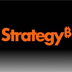 The image features the orange "Strategy₿" logo on a black background, representing the company (formerly MicroStrategy) discussed in the post about its $297 million Bitcoin wallet movement. The branded graphic visually anchors the news about Strategy's BTC treasury management activity.