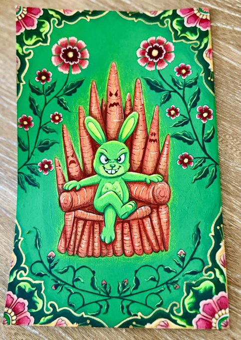 A folk art painting shows a green cartoon bunny sitting on an orange wooden throne against a green background decorated with red flowers and vines.