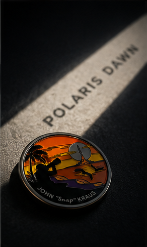 A commemorative pin badge for John 'Snap' Kraus from the Polaris Dawn mission, displayed on a dark surface with a shadow cast showing the 'POLARIS DAWN' name.
