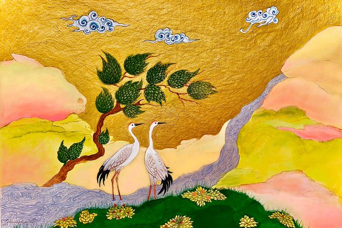 A textured painting in the style of traditional East Asian art depicting two white cranes standing on green grass with yellow flowers beneath a stylized tree, set against a golden sky with decorative blue clouds and pastel-colored rocky landscape.