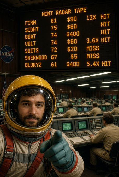 An astronaut in a yellow helmet gives a thumbs-up in a mission control room, beneath a digital scoreboard displaying "MINT RADAR TAPE" with entries like "FIRM 81", "SIGHT 75", and "BLOKYZ 61" alongside hit/miss designations.