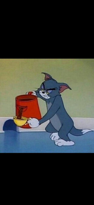 A classic cartoon frame showing Tom the cat holding a red bucket and a small yellow bowl.