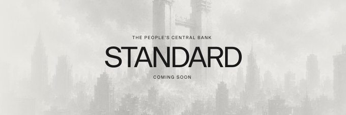 A minimalist black and white promotional banner for 'STANDARD', labeled 'THE PEOPLE'S CENTRAL BANK' and 'COMING SOON', set against a faded cityscape background.
