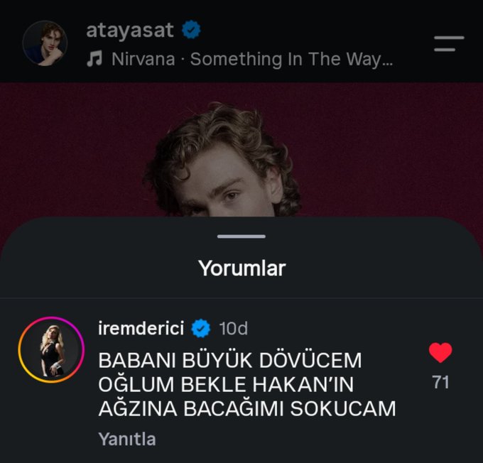 A screenshot of an Instagram post by "atayasat" featuring Nirvana's "Something In The Way" with a comment from "iremderici" (10d, 71 likes) writing in Turkish: "BABANI BÜYÜK DÖVÜCEM OĞLUM BEKLE HAKAN'IN AĞZINA BACAĞIMI SOKUCAM" (a threatening vernacular insult directed at "Hakan," meaning roughly "I'll beat your dad up son, wait, I'll shove my leg into Hakan's mouth"). The post's caption "our real fiction distinction SKDKAKSKWKDKWKD" reflects the dark, chaotic energy and the blurred real-versus-fictional barrier of the threatening comment, suggesting the user is playfully venting as if the insult were happening in a fictional storyline.
