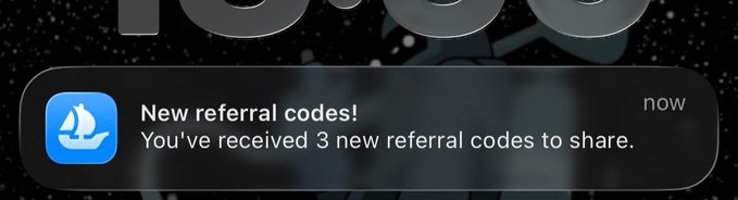 The main focus of the image is a text message or email alert displayed on an iPhone screen that reads, "New referals! You've received 3 new referational codes to share!". The content seems to be related to the app being referred to in the message. It appears that someone has sent this email, perhaps as a response to another email or a post with the same reference. However, without any visible text or additional context within the image, we cannot definitively identify who might have sent this alert or its significance.