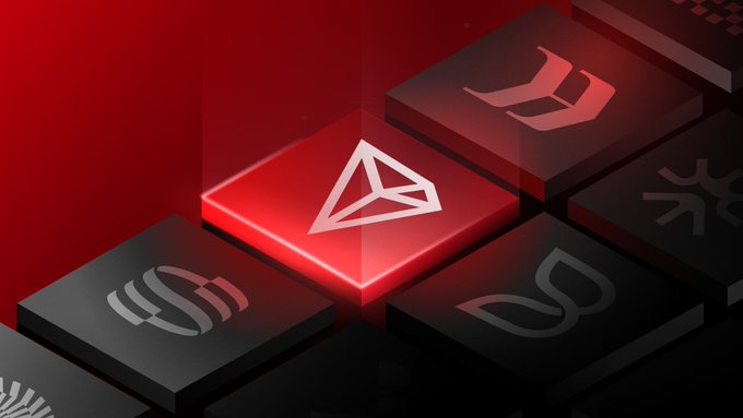 A digital illustration featuring 3D blocks with various gaming logos, highlighting a central red block with a white triangular symbol on a dark red background.