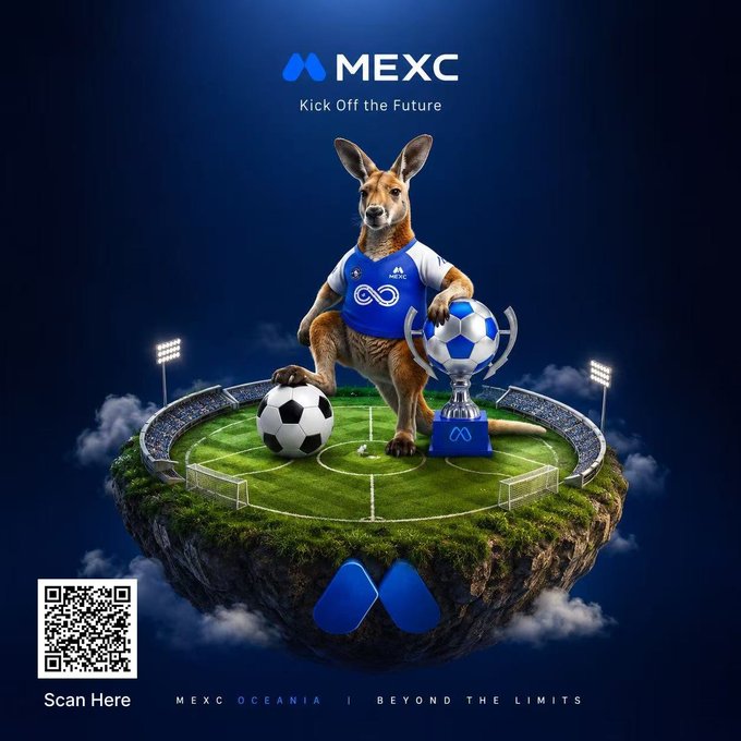 The image shows an advertisement for MEXC O Zaccania that features a kangaroo wearing a soccer uniform sitting on top of a green field surrounded by two sports balls, one blue and one white. The background depicts a football stadium with lights, adding a sense of excitement to the scene. The title of the ad emphasizes the concept of taking opportunities at the right moment in both football and cryptocurrency investing.

There is also a QR code visible in the image that provides additional information about the campaign or offers a chance to scan it and explore more details related to the MEXC O Zaccania event on November 11th, 2019.