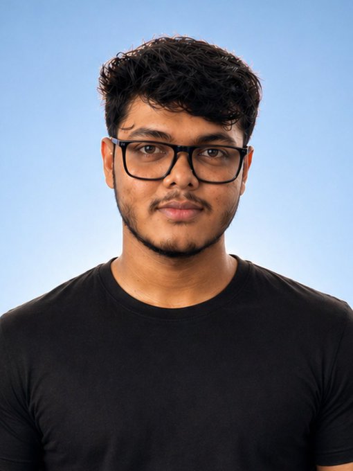 A young man with curly dark hair, glasses, and a black t-shirt poses for a portrait against a clear blue sky, likely representing one of the featured speakers at the upcoming ETHMumbai event announcement.
