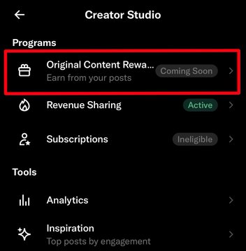 The image displays the X (formerly Twitter) Creator Studio menu highlighting the new "Original Content Rewards" program marked as "Coming Soon," which will replace the current "Revenue Sharing" system that shows as "Active." This visual relates to the post by illustrating X's transition from its existing Revenue Sharing model to a new Original Content Rewards program, potentially impacting creators' access to payouts.