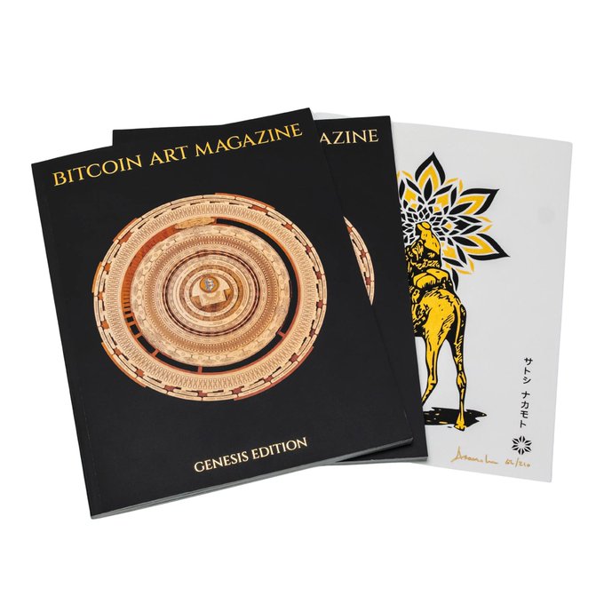 Two copies of "BITCOIN ART MAGAZINE - GENESIS EDITION" with a metallic circular design on the cover are displayed alongside a print featuring a yellow stag-like creature and a sunburst pattern with Japanese text.