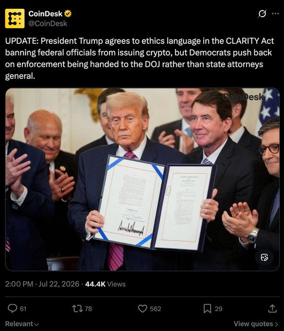 President Trump holds a document with a signature that appears to be his, while other officials stand around him, relating to an update on the CLARITY Act and cryptocurrency regulations.