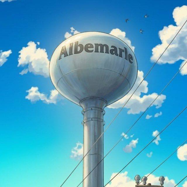 An illustration of a water tower with the word 'Albemarle' written across it against a blue sky with scattered clouds.