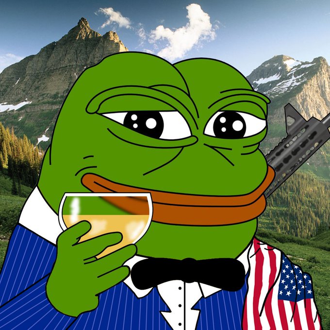 A Pepe the Frog meme dressed in a blue pinstripe suit with an American flag lapel and black bow tie, holding a glass of amber liquid with a gun visible behind him, set against a mountainous landscape.