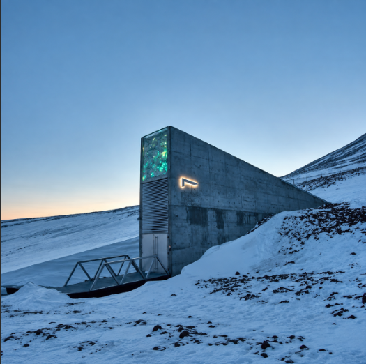 The image shows the entrance to the Svalbard Global Seed Vault-style Arctic World Archive, a concrete structure embedded in the snowy mountainside. This connects to the post about Bitcoin's source code being archived in a similar permafrost vault designed to preserve data for 1,000 years.