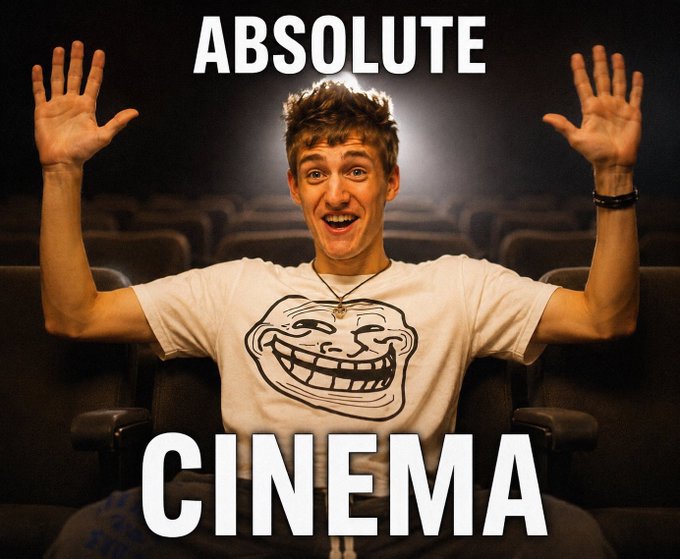 A man with an excited expression and raised hands wearing a Trollface meme t-shirt, with the text 'ABSOLUTE CINEMA' displayed in large white letters above and below him.