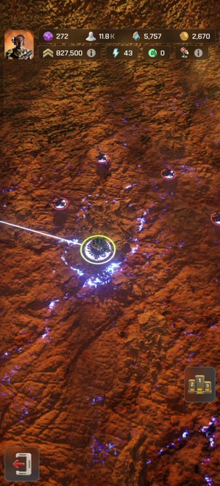 A screenshot of a mobile strategy game displaying a top-down view of a reddish rocky terrain with purple crystal formations, UI elements, and resource counters including '11.8K', '5,757', and '827,500'.