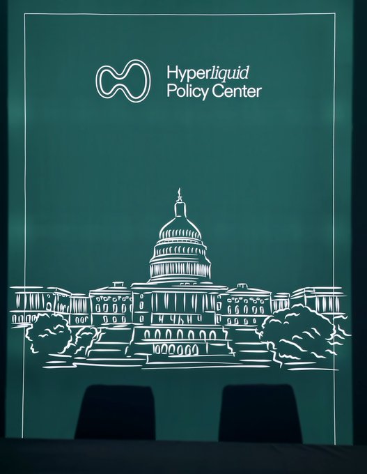 A chalkboard-style backdrop featuring a white line drawing of the U.S. Capitol building with the "Hyperliquid Policy Center" logo at the top, set up at a conference venue with two chairs visible at the bottom.

The image relates to the post by visually representing HPC's policy focus (symbolized by the Capitol building) alongside its engagement with the onchain community, suggesting their presence at policy discussions tied to events like TOKEN2049 in Singapore.