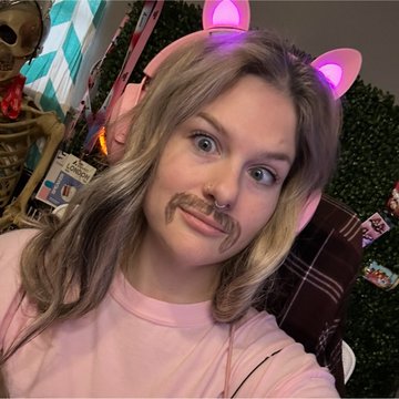 A woman with blonde hair sports glowing pink cat ears and a fake mustache, playfully embracing the "Mullet" meme aesthetic referenced in the post about the $Mullet token on Solana.