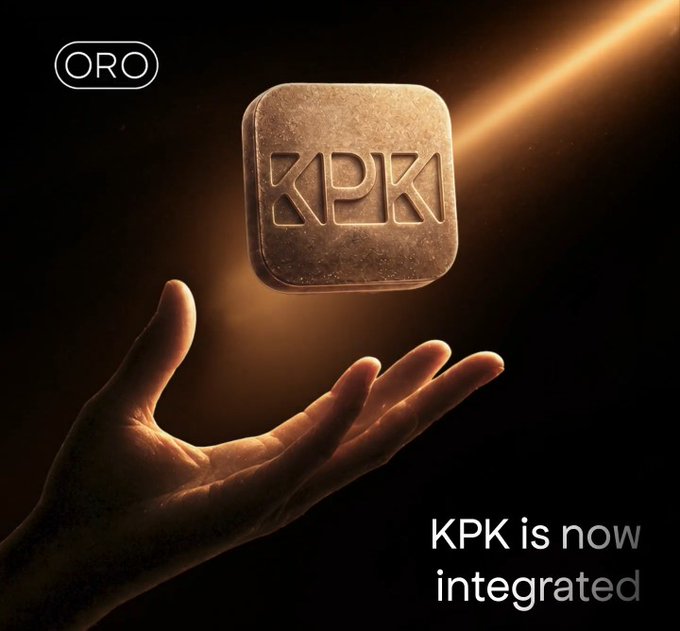 The image features a hand holding up a square object that has the letters "KP" written on it, which appears to be a golden coin or token. The background of the image is black, making the golden object stand out prominently. The caption below the image reads "KP is now integrated". This suggests that the golden object might represent a new integration between different platforms or services in the world of cryptocurrency and DeFi.