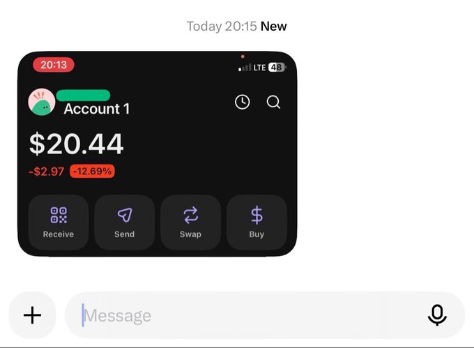 A screenshot of a crypto wallet app showing "Account 1" with a balance of $20.44, down $2.97 (-12.69%), featuring Receive, Send, Swap, and Buy options, humorously shared to celebrate a new crypto user making their first $20—despite the balance showing a loss.