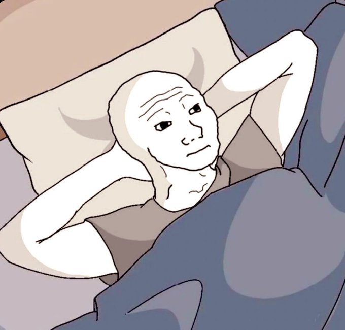 An illustration of a bald, wrinkled 'wojak' meme character lying in bed with his hands behind his head, covered by a gray blanket and resting on a pillow.