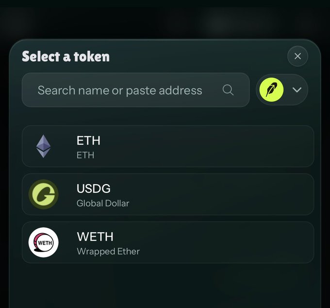 A "Select a token" modal window displays a search bar and three token options: ETH (Ether), USDG (Global Dollar), and WETH (Wrapped Ether), illustrating a step in the token selection process for executing trades on Robinhood as described in the user guide.