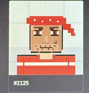 A pixel-art style cross-stitch artwork labeled "#2125" depicting a character with red hair or headwear in a red and white striped shirt.